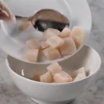 A chef portions diced Cobia to make ceviche