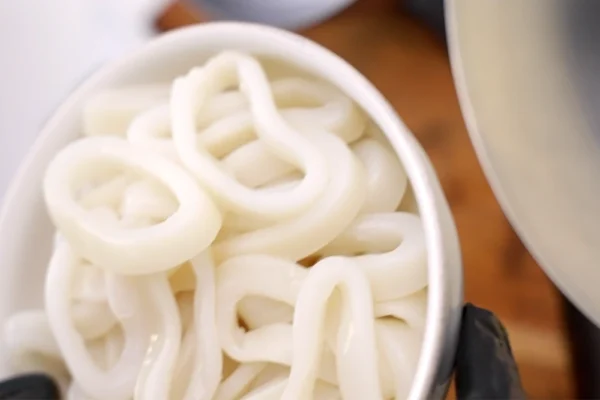 Frozen-Calamari-Rings Raw calamari rings in a bowl before being breaded