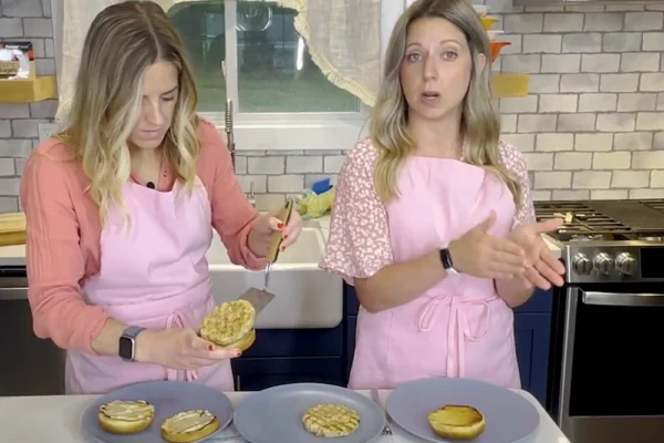 Frozen-Shrimp-Burger-Urner-Barry Two women in a kitchen plating cooked shrimp burgers