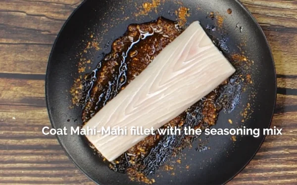 Mahi-Mahi-Fillets Mahi Mahi portion marinating in a dish with seasoning