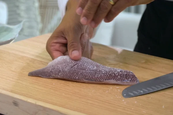 Snapper-Fillet-King A chef salts a King Snapper fillet