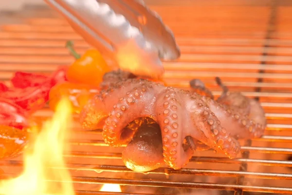 Whole-Octopus-Grilled A whole octopus is grilled over fire