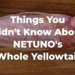 A chef holds a whole yellowtail snapper with the text "Things You Didn't Know About NETUNO's Whole Yellowtail"