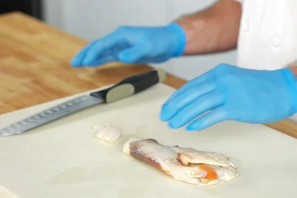 Wholesale-Conch-Meat-Netuno A piece of conch meat on a cutting board