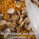 White clams added to a pasta dish to make clams vongole