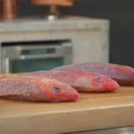 Whole Lane Snapper, Whole Caribbean Red Snapper, Whole Yellowtail Snapper on a cutting board with lemon and limes along with text that displays a fact about each fish